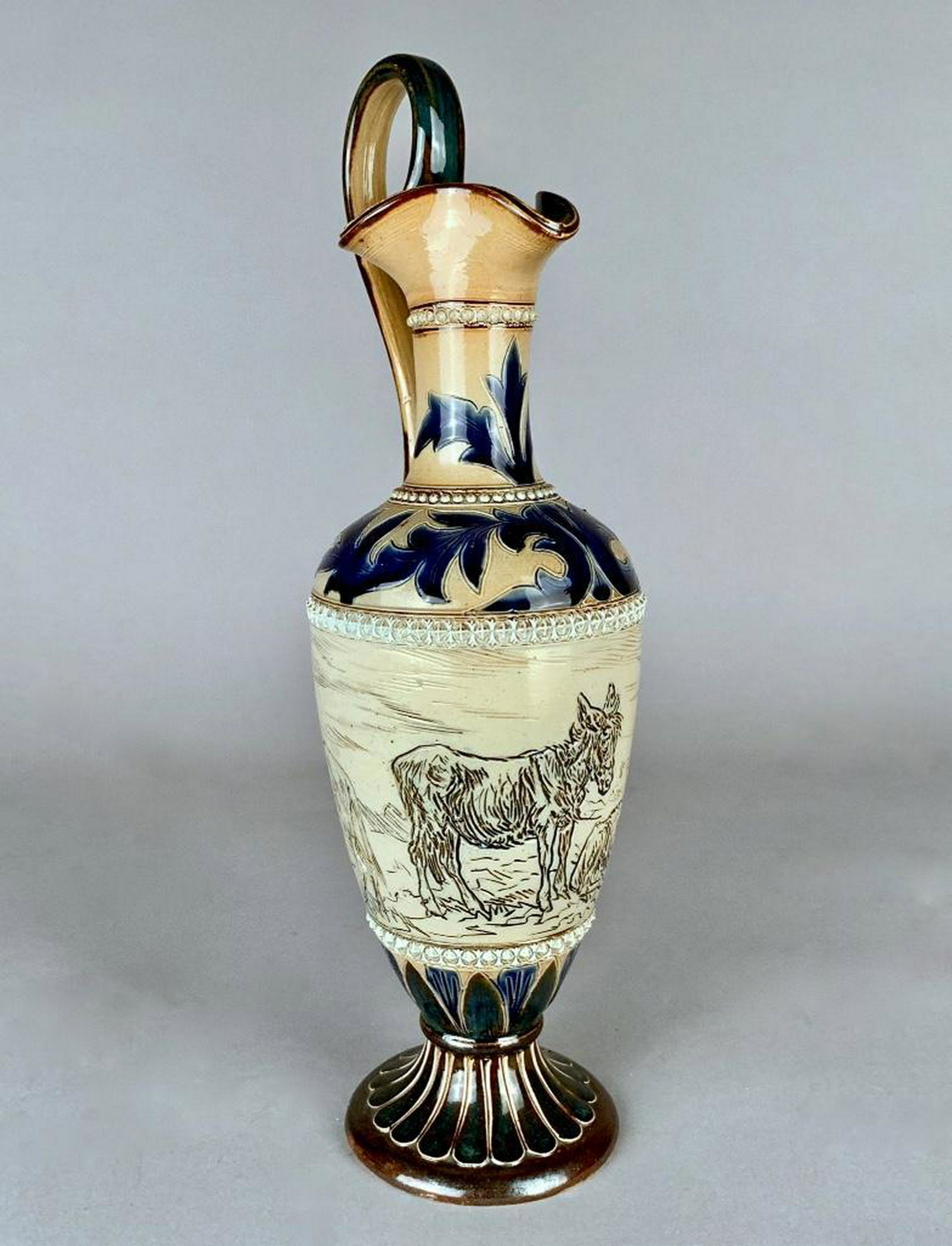 Hannah Barlow for Doulton Lambeth Stoneware Ewer,1882: A Doulton Lambeth ewer decorated by Hannah Barlow (British 1851-1916) 1880-1902, of baluster form with applied handle and everted spout, decorated in sgraffito around the body with donkeys in various 