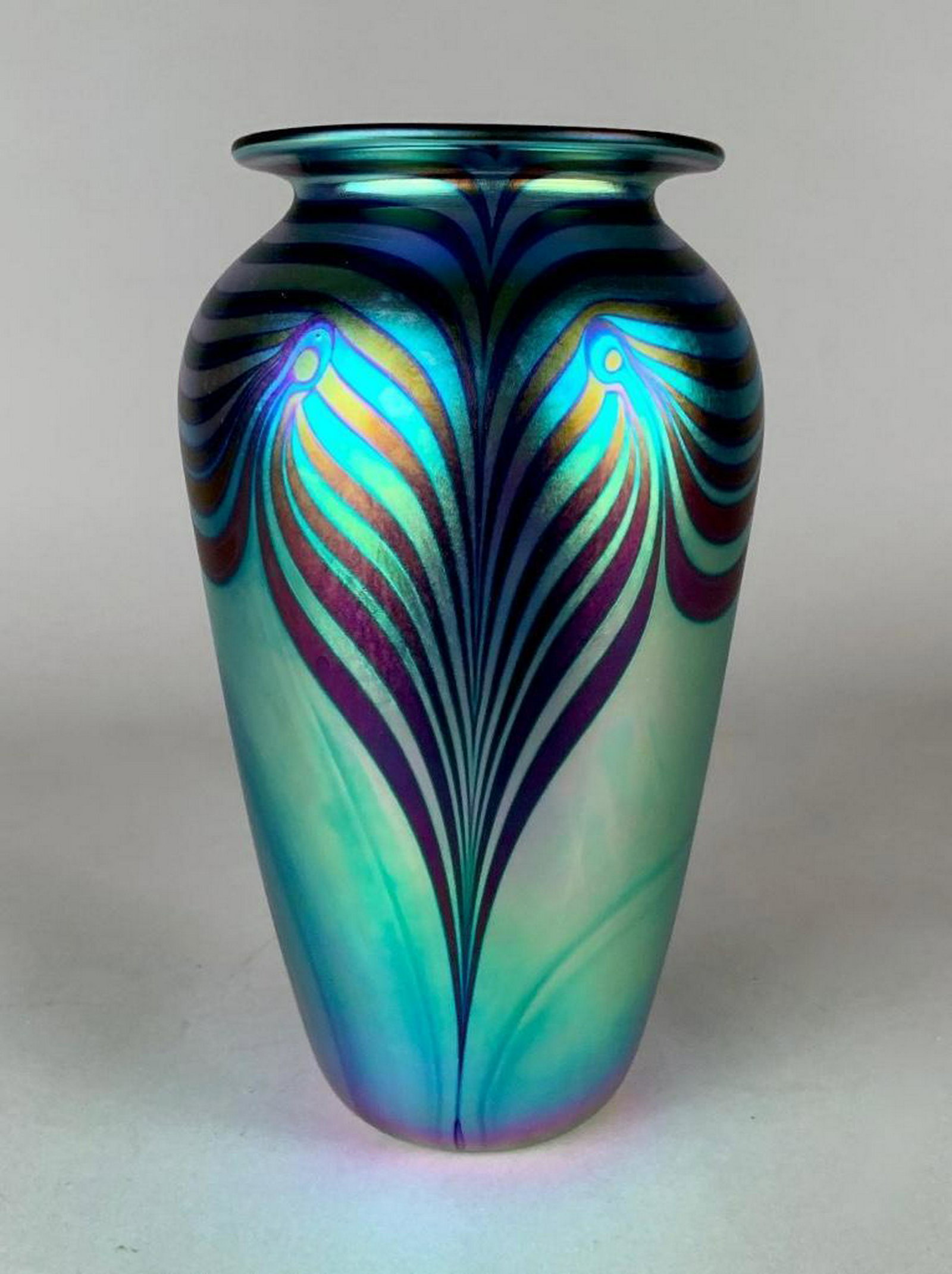 Robert Eicholt Art Glass Vase, 1999: Robert Eicholt Art Glass Vase, 1999Of baluster form in iridescent glass with pulled and trailed decoration in purple on the green ground. Signed Eicholt , dated 1999, UCFE 9 in.h. 6 in. w . at widest.