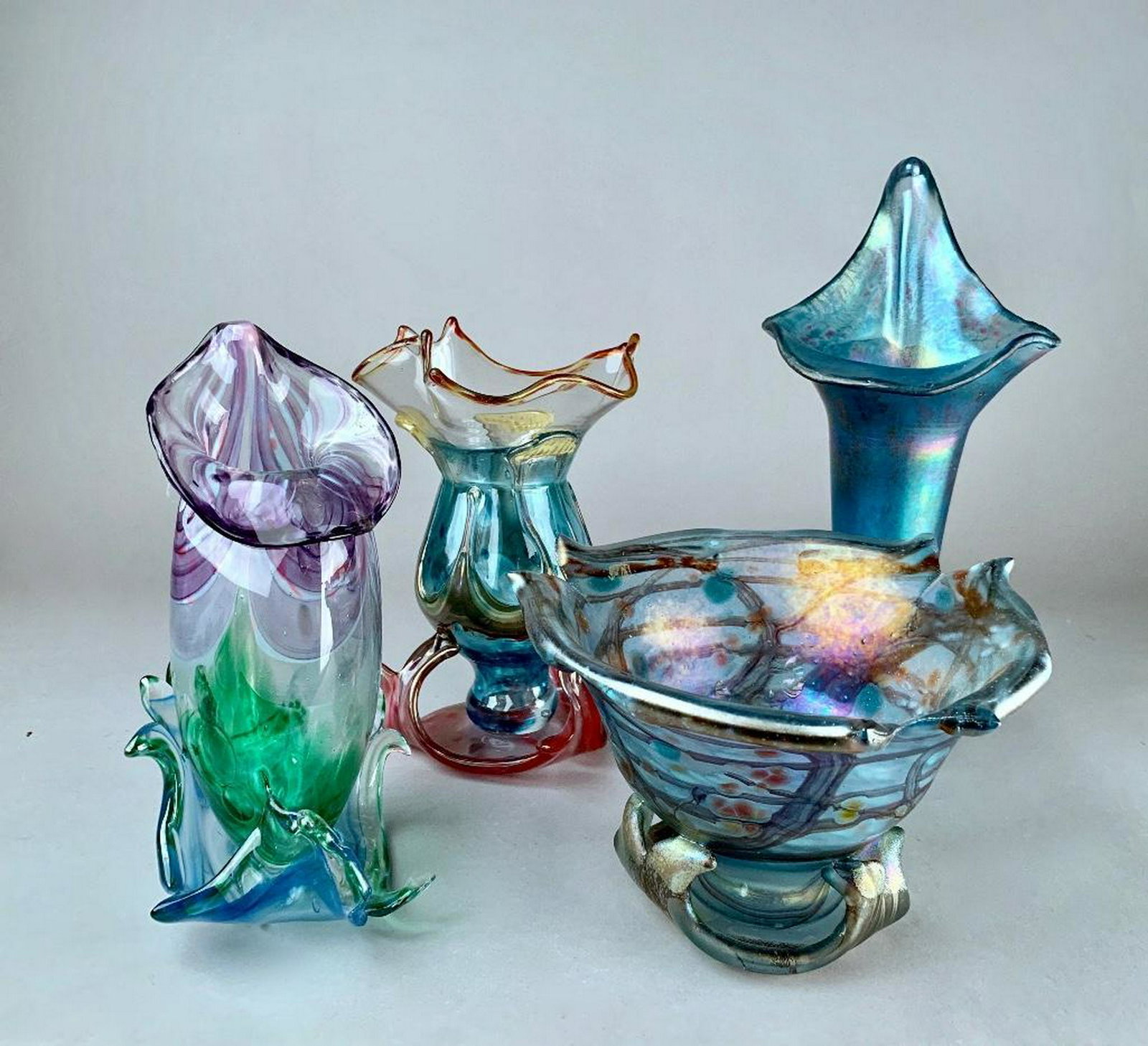 Four Modern Studio Glass Vases: A footed bowl by Anton Vojacek, together with three jack-in-the-pulpit style vases, unsigned. 12.5 in.h. of tallest Condition: Good with no damage or repair
