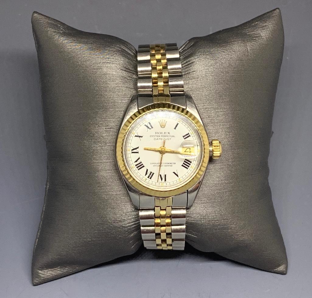 Ladies Rolex Two-tone Oyster Perpetual Datejust: Style #691730 Rolex stainless steel and gold bezel watch with serial #6142386 with jubilee bracelet, #62523 D14. Swiss Rolex; white porcelain dial marked with gold Roman numerals with luminescent d