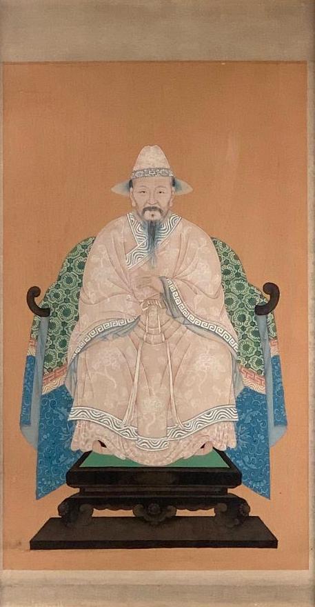Chinese Portait of a Merchant: Chinese Portrait of a merchant, seated, wearing peaked hat and tan colored robes, with a detailed green silk cloth over the chair. Framed 22 x 13 in. 29 x 17 in. as framed Condition: Appears to be ver