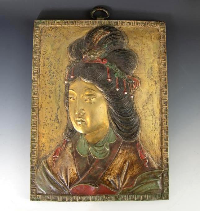 Unusual Chinese Bronze Relief Plaque, 18th/19thc.: Rectangular form cast in high to low relief with a bust length depiction of Guanyin, cold painted and patinated, the goddess with elaborate hairdo and headdress surmounted by phoenix ornament, the hea