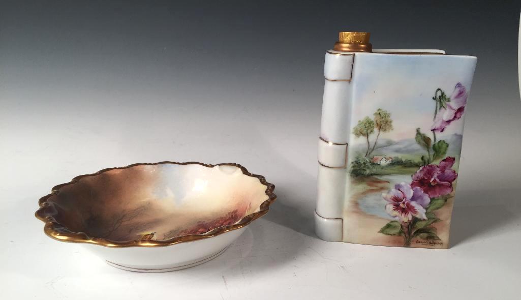 Two Pieces of Limoges Porcelain: Two Pieces of Limoges Porcelain, comprising a flask in the form of a book, signed Coral de Ana and painted with violets in a landscape, and a candy dish painted with pheasants and grouse. 6 in. h. (1s