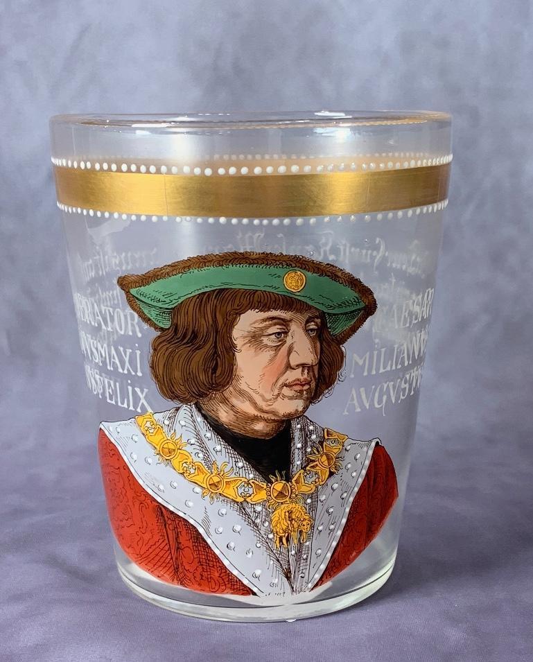 German Enameled Glass Beaker, 19thc.: Of tapering conical form in clear glass enameled with a portrait of Emperor Caesar Maximilianus Augustus wearing the order of the golden fleece in colored enamel and gilding. 6 in. h x 4.75 in. dia. C