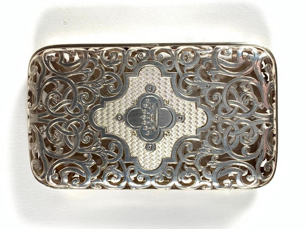 Russian Silver Openwork Cigar Case, 19thc.: Russian Silver Openwork Cigar Case, 19thc., St.Petersburg, maker's mark CE, with openwork scroll forms centering cartouches on each side, one with a monogram, the other with a crown on an engine turne