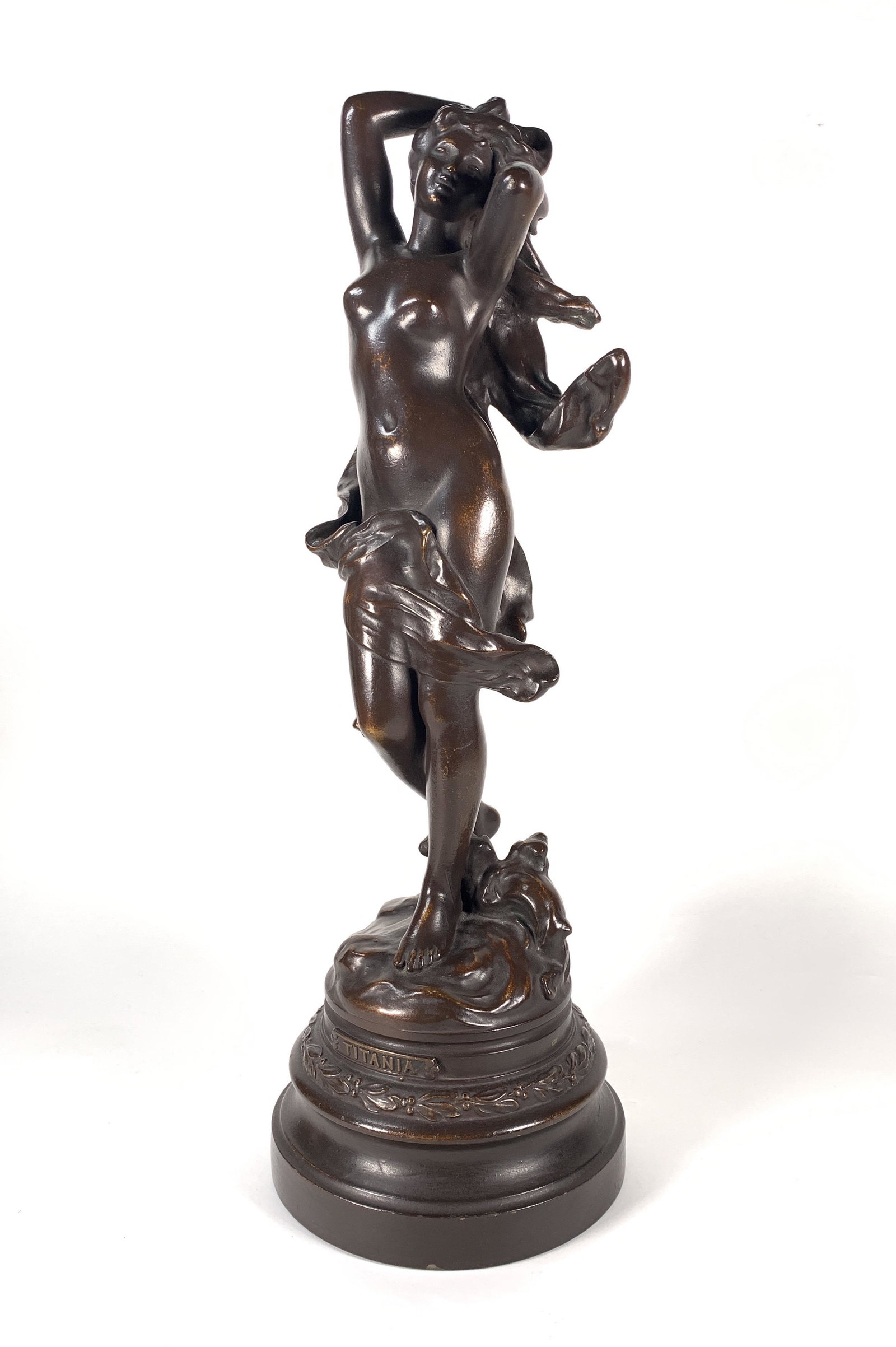 White Metal Figure of Titania: White Metal Figure of Titania, the wind blown nude goddess standing in waves, with drapery blowing around her form. 20 in.h. Condition: Minor wear to patina