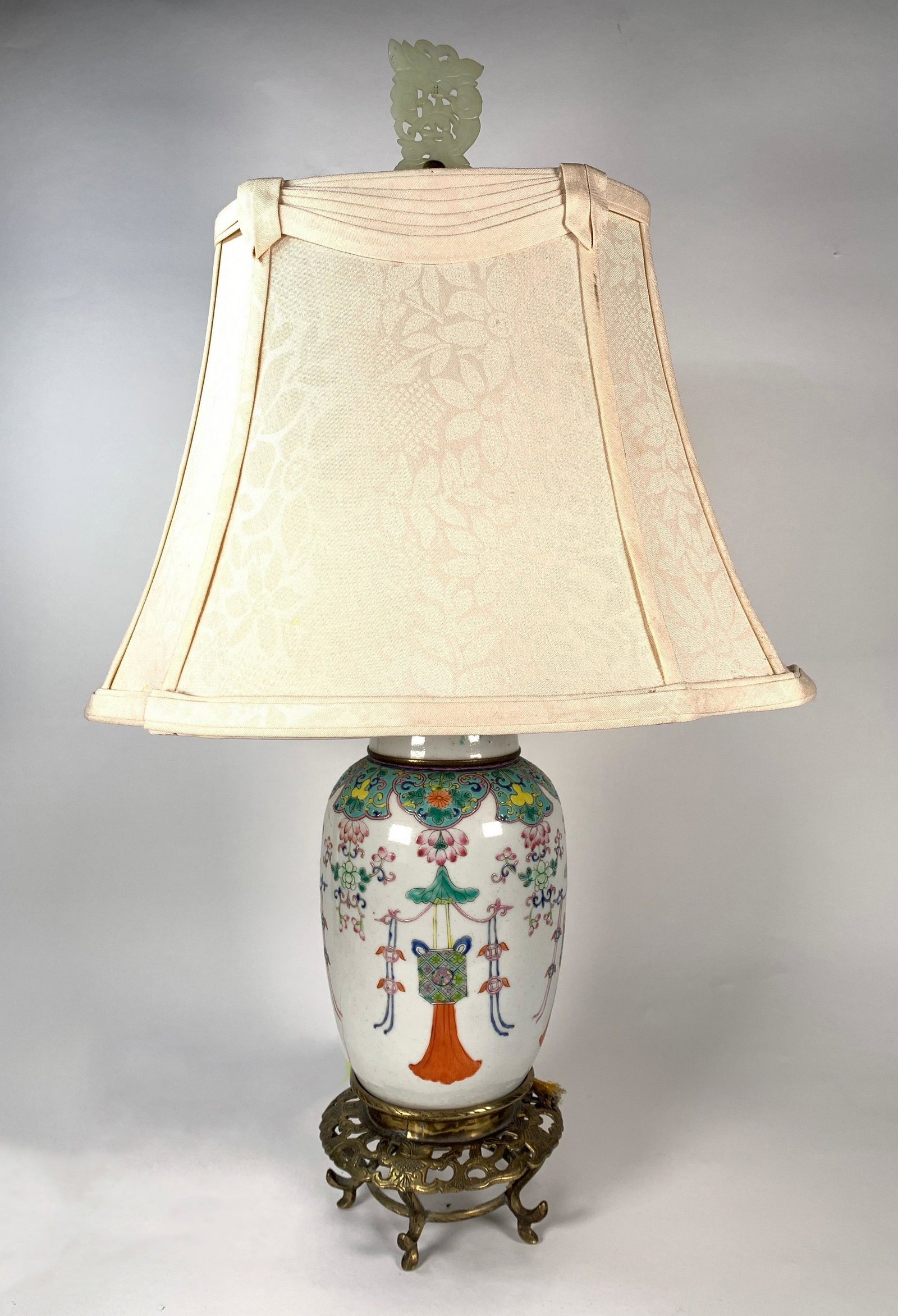 Chinese Porcelain Vase Fitted as Table Lamp: Chinese Porcelain Vase Fitted as Table Lamp, ginger jar form decorated in famille rose glaze with pendant lanterns and floral designs, raised on a brass base. 11 in. h. to top of lamp. Condition: very