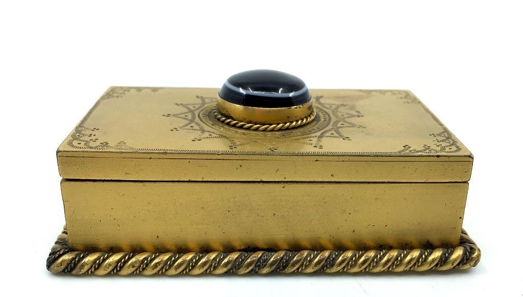 Gilt Bronze and Agate Box, 19thc.: Gilt Bronze and Agate Box, 19thc., the rectangular form with hinged cover set with an agate in a bezel and rope twist setting, with engraved star pattern, the base with a rope twist border. No signatu