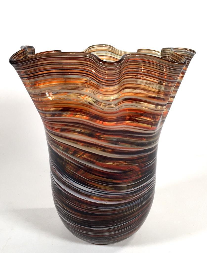 Contemporary Art Glass Vase: Contemporary Art Glass Vase, tall form with ruffled rim in clear glass decorated with a concentric stripe pattern in brown blue and white with copper foil inclusions. No signature found. 11 x 10 x 9 i