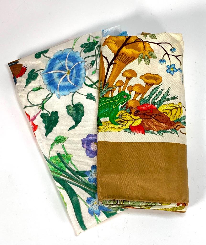 Two Gucci Silk Scarves in Gucci Box: Two Gucci Silk Scarves, designs by Vittorio Accornero, depicting Mushroom, floral and insect specimens, 100% silk twill with hand rolled edges. 34 x 34 in. each. Condition: Very good