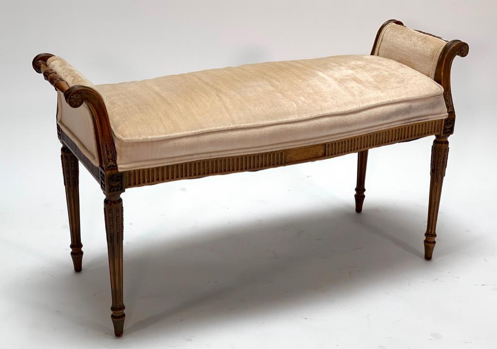Louis XVIth Style Upholstered Window Seat: Rectangular upholstered seat with outscrolled upholstered arms, raised on flutedÂ tapering legs. 23 in.h. x 40 in.w. x 17 in.d.