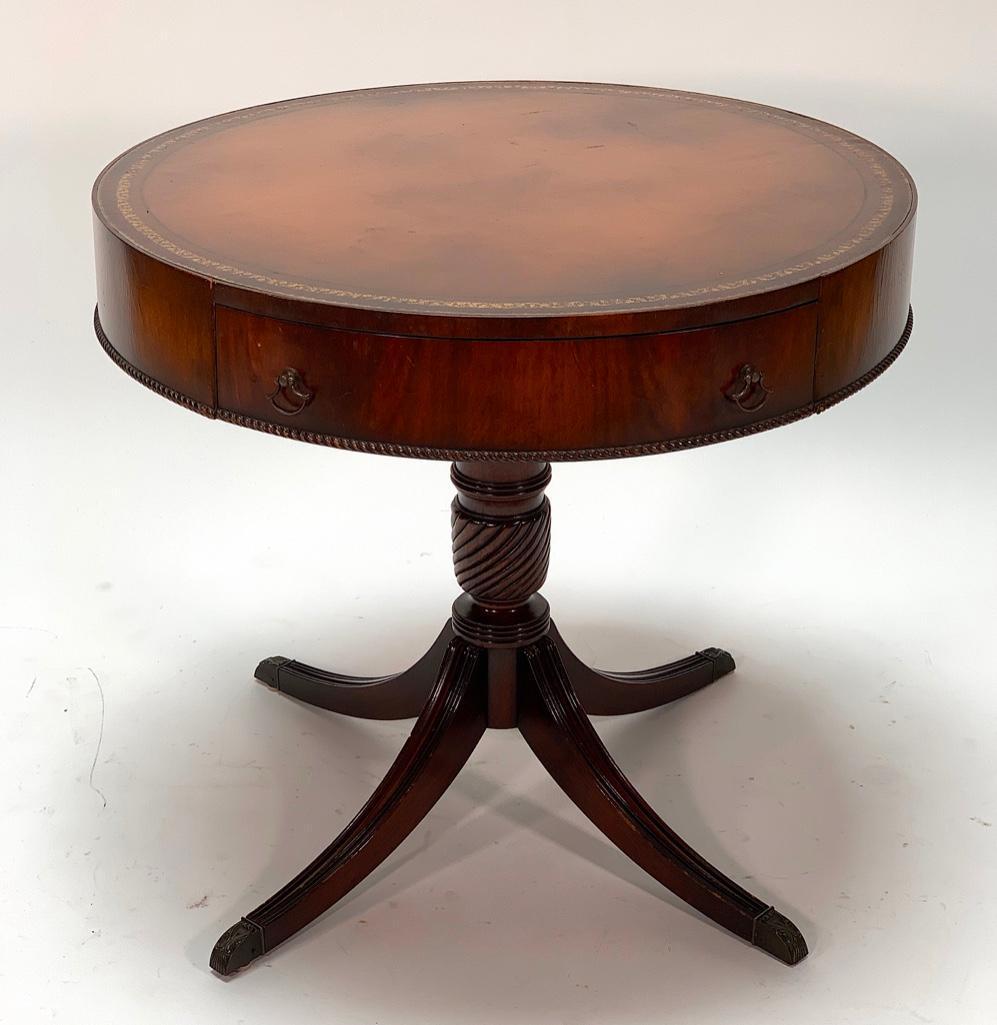 Magogany Drum Table: Leather inset top. 30 in. dia. x 27 in.h.