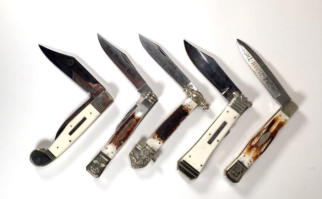 A Lot of Five Folding Knives: Horn and bone handles, some engraved Parker Cut Co., including "The Real Virginia Knife", 10.75 in., "We Must defend Ourselves" C. Congreue bowie, 10.75 in., "I Never Fail", IXL model, 11 in., "New Or