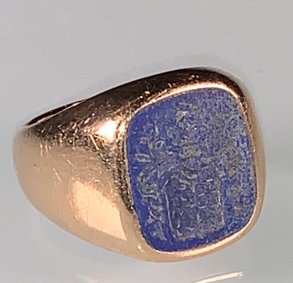 14K Yellow Gold Gentlemans Signet Ring: Simple gold band with squared Lapis Lazuli stone intaglio engraved with a crest.Dimensions: 9 dwt. Ring size 7