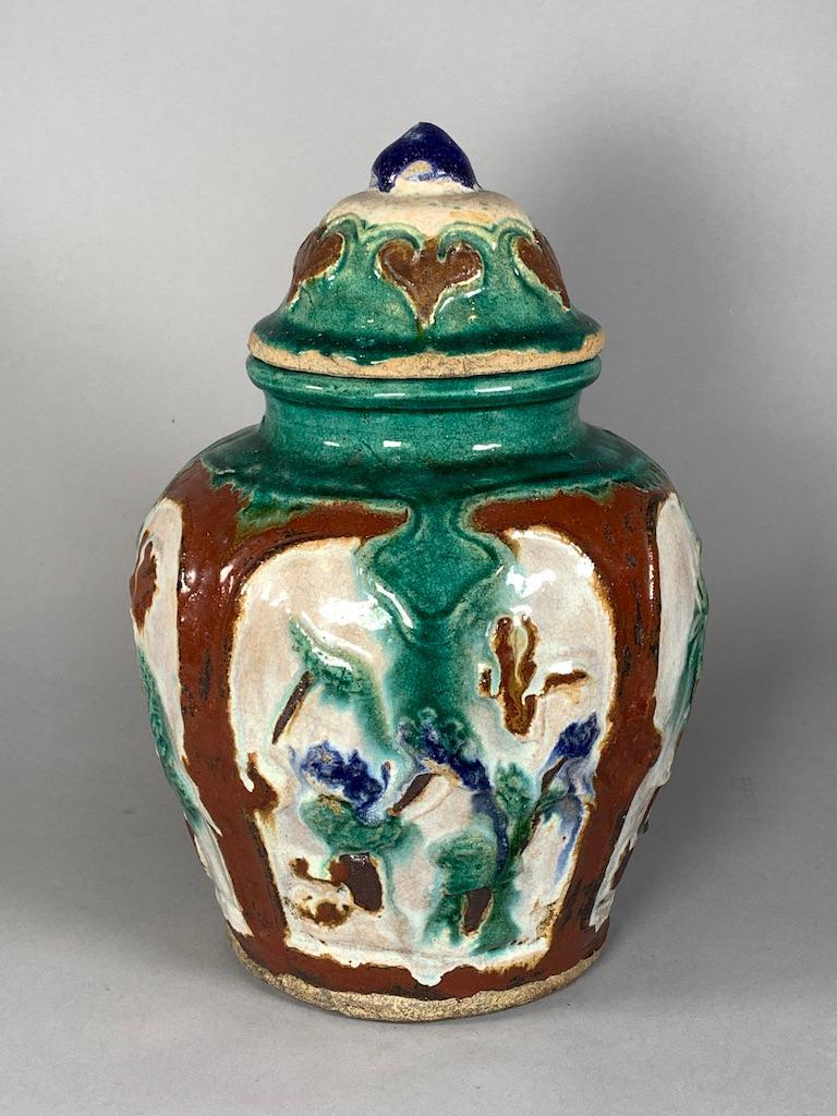 Chinese Glazed Earthenware Vase: Chinese Glazed Earthenware Vase, retailed by Horchow, late 1990â€™s, of baluster form with molded designs of stylized trees. Dimensions: 12.25 in.h. x 9 in. w. Condition: Good with natural roughn