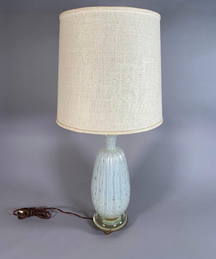 Barovier and Toso Glass Table Lamp: Barovier and Toso Glass Table Lamp, shouldered ribbed form in clear glass internally decorated with white and silver gilt foil inclusions Dimensions: 13.5 in. glass only. Condition: Very good with no 