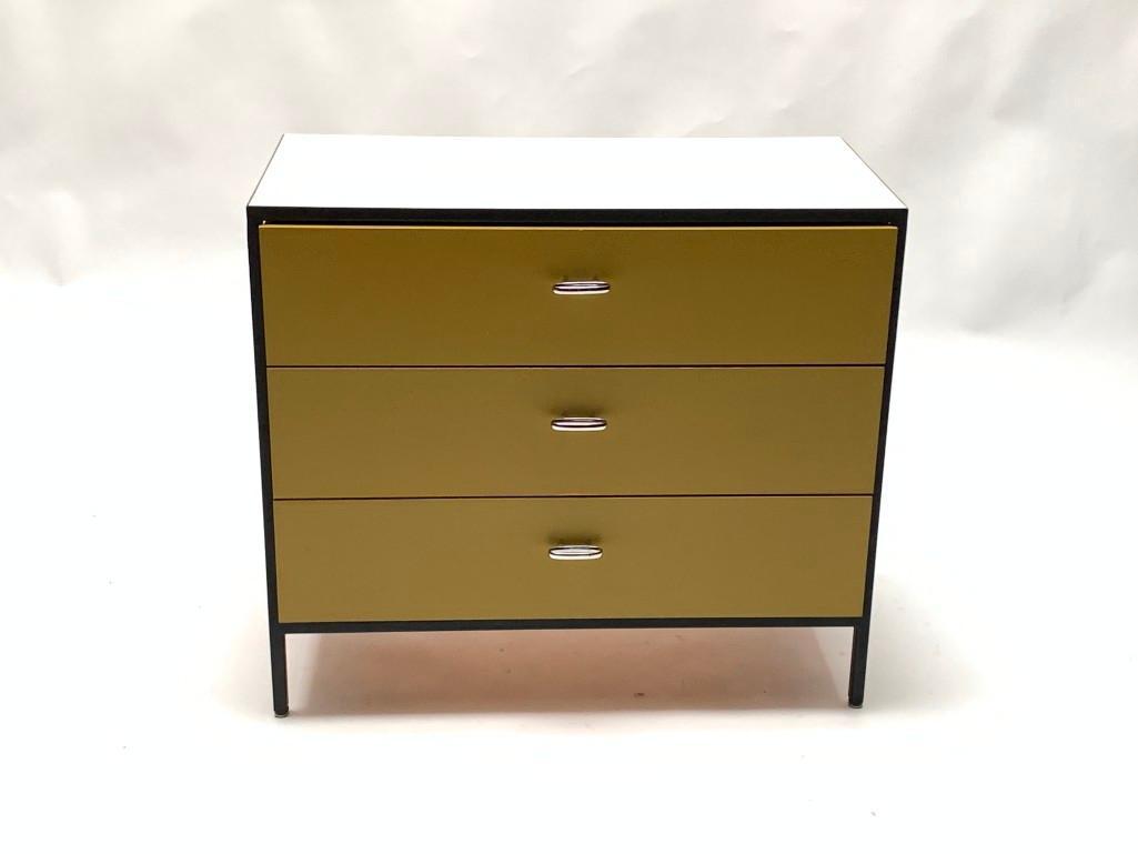 George Nelson For Herman Miller Chest of Drawers: George Nelson For Herman Miller Chest of Drawers, c. 1950-60, steel frame with painted wood, the rectangular white laminate top over three frieze drawers enameled in mustard, the sides in green, with 