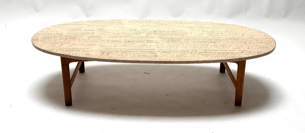 Folke Ohlsson For Dux Travertine Top Coffee Table: Folke Ohlsson For Dux Travertine Top Coffee Table, oval travertine top on walnut base with turned legs joined by stretchers, stamped signature. Dimensions: 16 in.h. x 65 in.l. x 29.5 in. d. Condition: