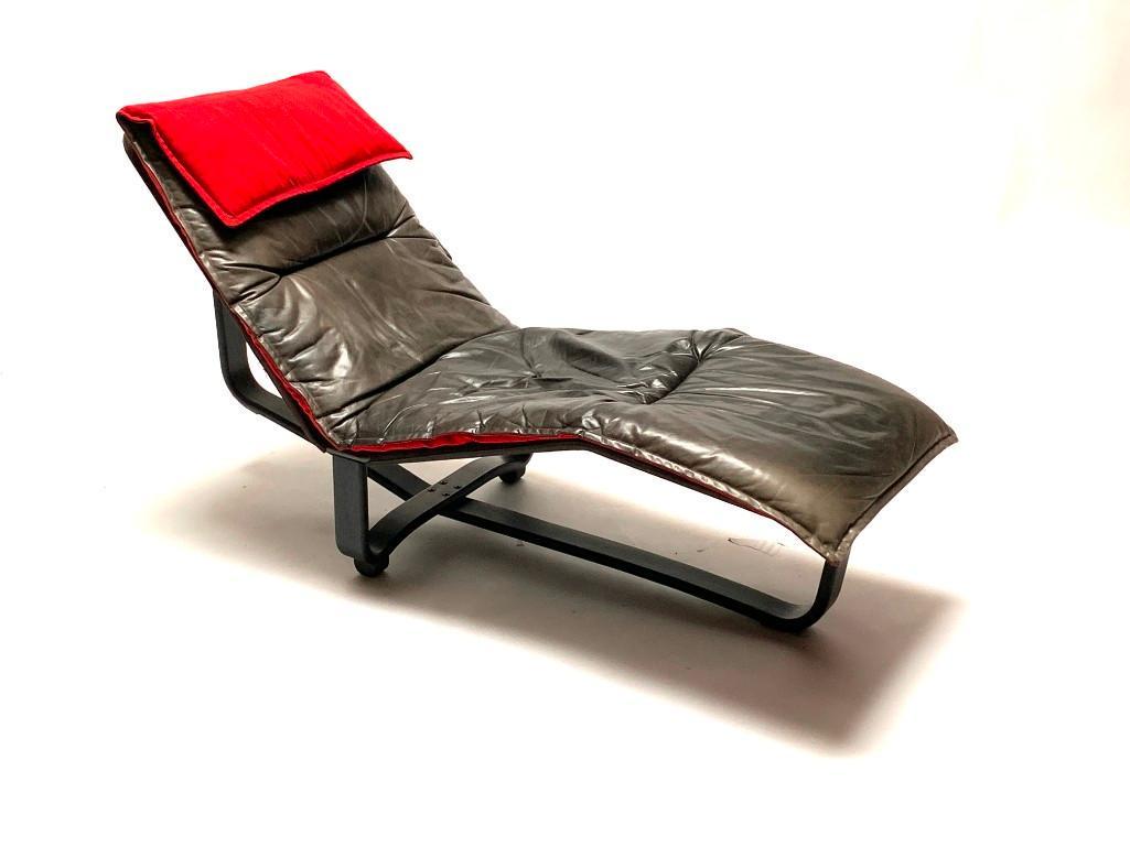 A Mid-Century Modern Chaise Lounger by Ingmar & Knut: Ca. 1970. Made in Norway, black bentwood wood frames, stretched black taught nylon with leather reversible cushion. It tilts between two positions, from a sitting to fully reclined. The chaise cushion