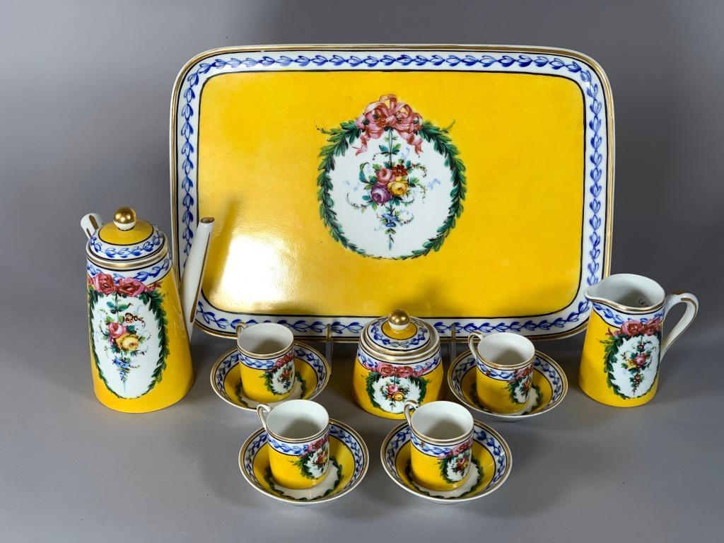 Child's Sevres Style Porcelain Chocolate Set: Child's Sevres Style Porcelain Chocolate Set, comprising tray, chocolate pot, cream jug and covered sugar and 4 cups and saucers, all decorated in bright lemon yellow hand painted with pendant floral 