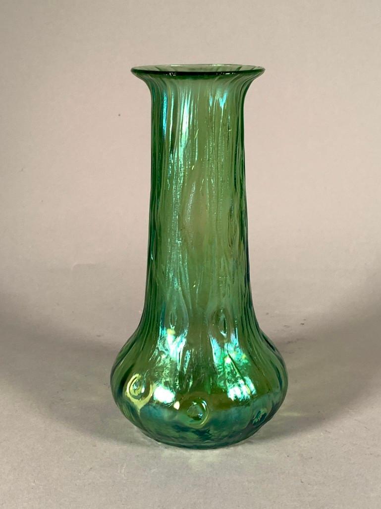Loetz or Bohemian Iridescent Green Glass Vase: Loetz or Bohemian Iridescent Glass Vase, "Rusticana," style with tree bark an knot design in iridescent green glass. Dimensions: 7.5 x 4 in. Condition: Very good
