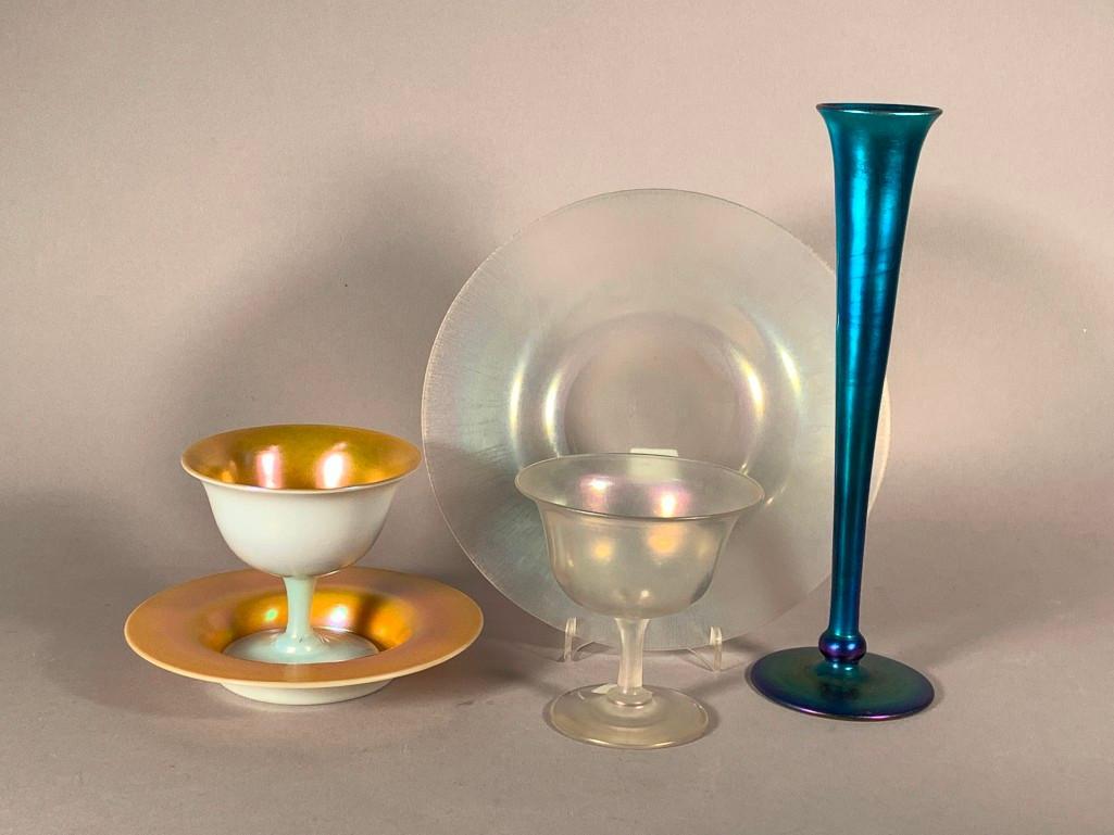Lot of Steuben Aurene and Verre de Soie Glass: Lot of Steuben Aurene and Verre de Soie Glass, comprising a Gold Aurene and Calcite sherbet and underplate; a Verre de Soie sherbet, a Verre de Soie salad plate, and a Blue Aurene flared bud vase. Dim