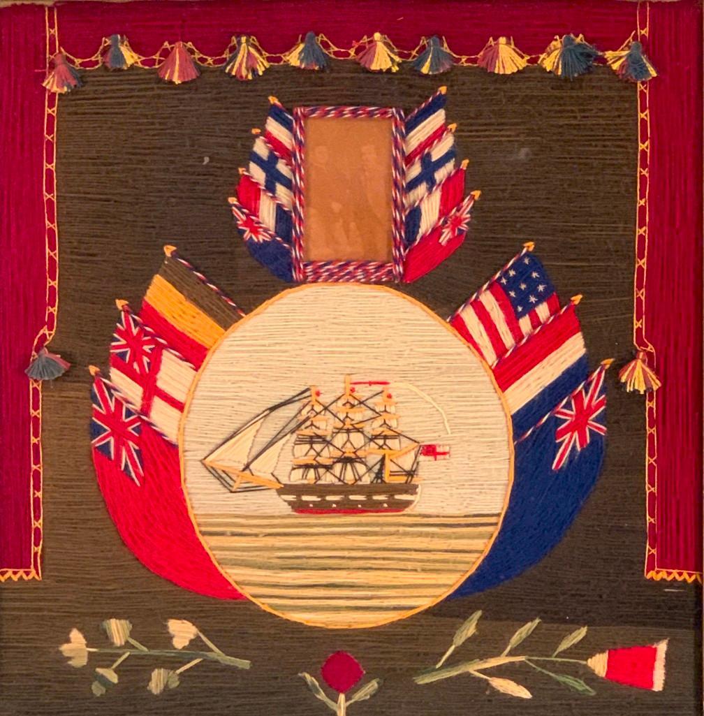 Sailor's Wool Embroidery Picture with Photograph: Sailor's Wool Embroidery Picture with Photograph, the center stitched with a three masted clipper ship reserved in a circular medallion below a photographed portrait of two gentlemen, each flanked by 