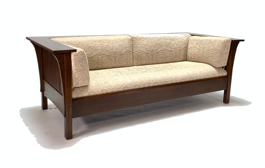 Stickley Oak Sofa: Stickley Oak Sofa, wide squared oak back and arms over squared rails, fitted with upholstered cushions, on squared base. Framed stamped and with tag on bottom. Dimensions: 30 x 85 x 37.5 in. Condition