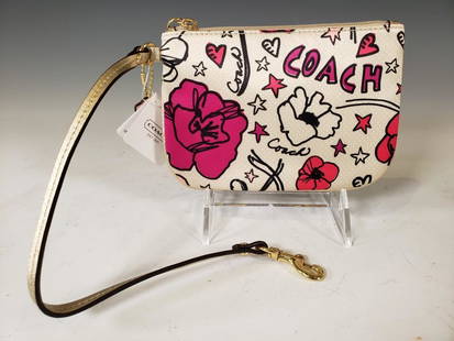 Coach Daisy Print Small Wristlet NWT: Coach® Daisy Print Small Wristlet. Satin Printed Wristlet with Flowers and Coach® Insignias; Gold Leather Trim and Strap. Brass hardware Dimensions: 4.25 x 6.25 in. Condition: New with