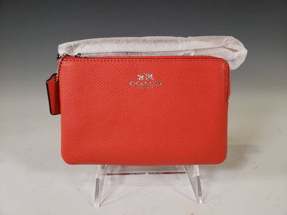 Coach Crossgrain Corner Zip Wristlet in Orange NWT: Coach® Crossgrain Corner Zip Wristlet in Orange. Orange Leather and Palladium Hardware. Stamped logo in silver gilt. Model Number: F53429. Dimensions: 4.25 x 6.5 in. Condition: New