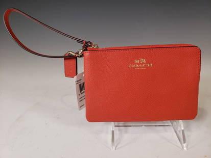 Coach Crossgrain Corner Zip Wristlet in Carmine NWT: Coach® Crossgrain Corner Zip Wristlet in Carmine Colour. Carmine Colour Leather and Brass Hardware. Model Number F53429. Suggested Retail $75.00 Dimensions: 4 x 6 in. Condition: New and unused. NEUE