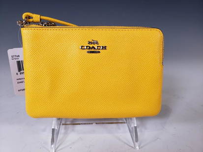 Coach Crossgrain Small Wristlet in Yellow NWT: Coach® Crossgrain Small Wristlet in Yellow Leather. Yellow Leather and Silver Hardware. Model Number: 57768. Suggested Retail $65.00 Dimension: 4.25 x 6.5 in. Condition: New and Unused. 