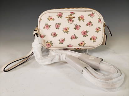 Coach Flower Patch Crossbody Clutch NWT: Coach® Flower Patch Crossbody Clutch Chalk. Floral Printed Chalk Coated Canvas and Brass Hardware. Model Number: 13316 Suggested retail $175.00 Dimensions: 5 x 8 x 1.5 in. Condition: New and