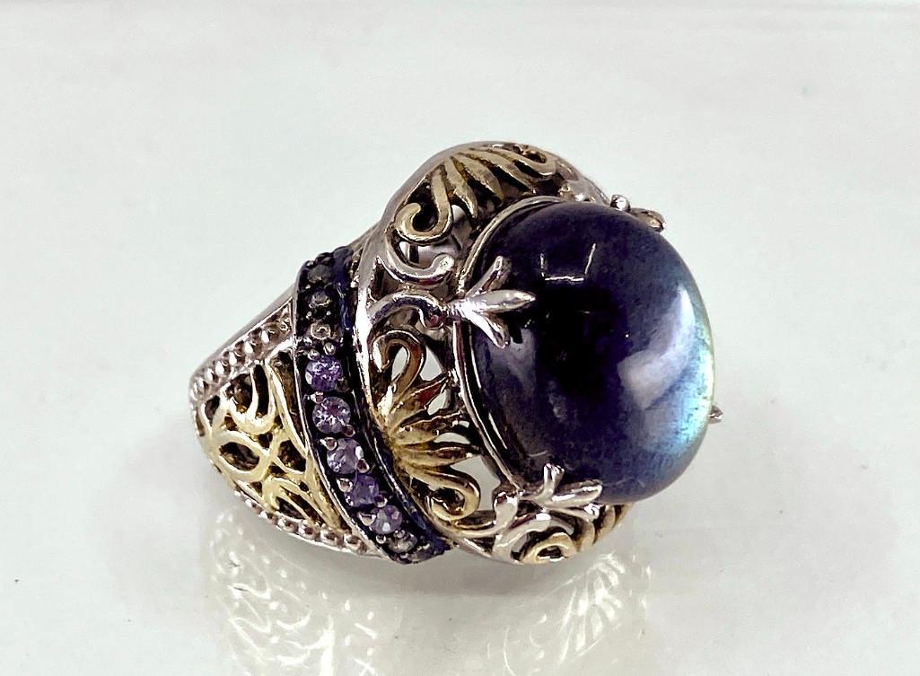 Labradorite Cabochon Ring: Gorgeous polished cabochon Labradorite, set into sterling silver mount, with 10 small Tanzanite accents stones, sterling has gold vermeil accents, Aprx 6.5 ring size. Condition: very nice.