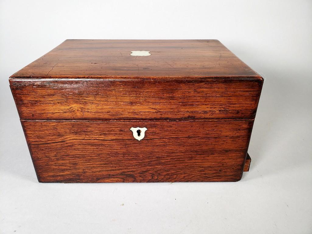 English Mahogany Dressing Box, 19thc.: English Mahogany Dressing Box, 19thc., mahogany box with inlaid mother of pearl medallion and escutcheon, fitted interior with padded velvet covers, crystal jars and bottles, some with silvered covers
