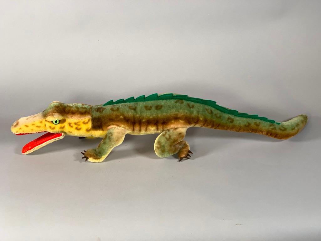 Steiff Mohair "Gaty" Alligator: Steiff Mohair "Gaty" Alligator, walking alligator with glass eyes, felt mouth, claws and top scales, with paper tag. Dimensions: 27 in.l. x 5 in.w. Condition: repair to felt in mouth, some general wea