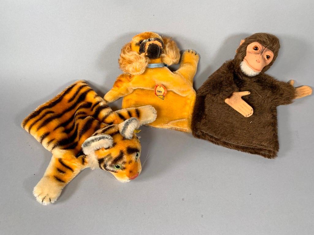 Three Vintage Steiff Mohair Hand Puppets: Three Vintage Steiff Mohair Hand Puppets, comprising; Monkey, Tiger, and Pekingnese dog, 'Peky.' Dimensions: 9 x 9 in. each Condition: Monkey without tags, but in god condition, Tiger and Peky with ta