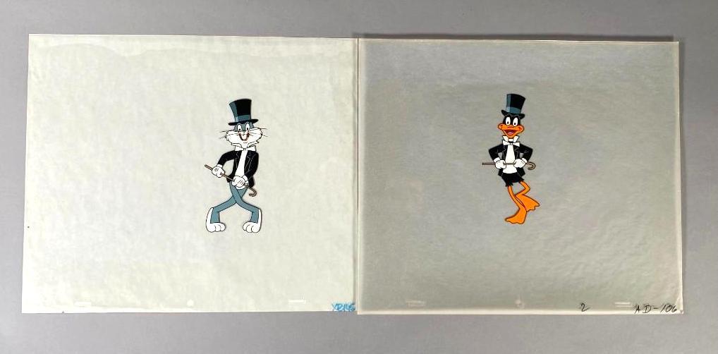 Bugs Bunny and Daffy Duck In Tuxedos, Animation Cels: Bugs Bunny and Daffy Duck In Tuxedos, Animation Cels, each in top hat dancing with cane. On Clear celluloid background. Dimensions: 10 x 12 sheet size. Condition: Very Good