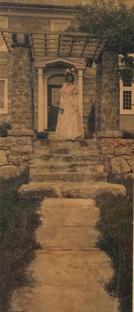 Wallace Nutting, "Across the Meadows": Wallace Nutting (American 1861-1941) "Across the Meadows," hand-colored photograph, signed in pencil lower right, titled lower left, framed. Dimensions: 4 x 9.5 in. image size 10.75 x 16.75 in. as fra