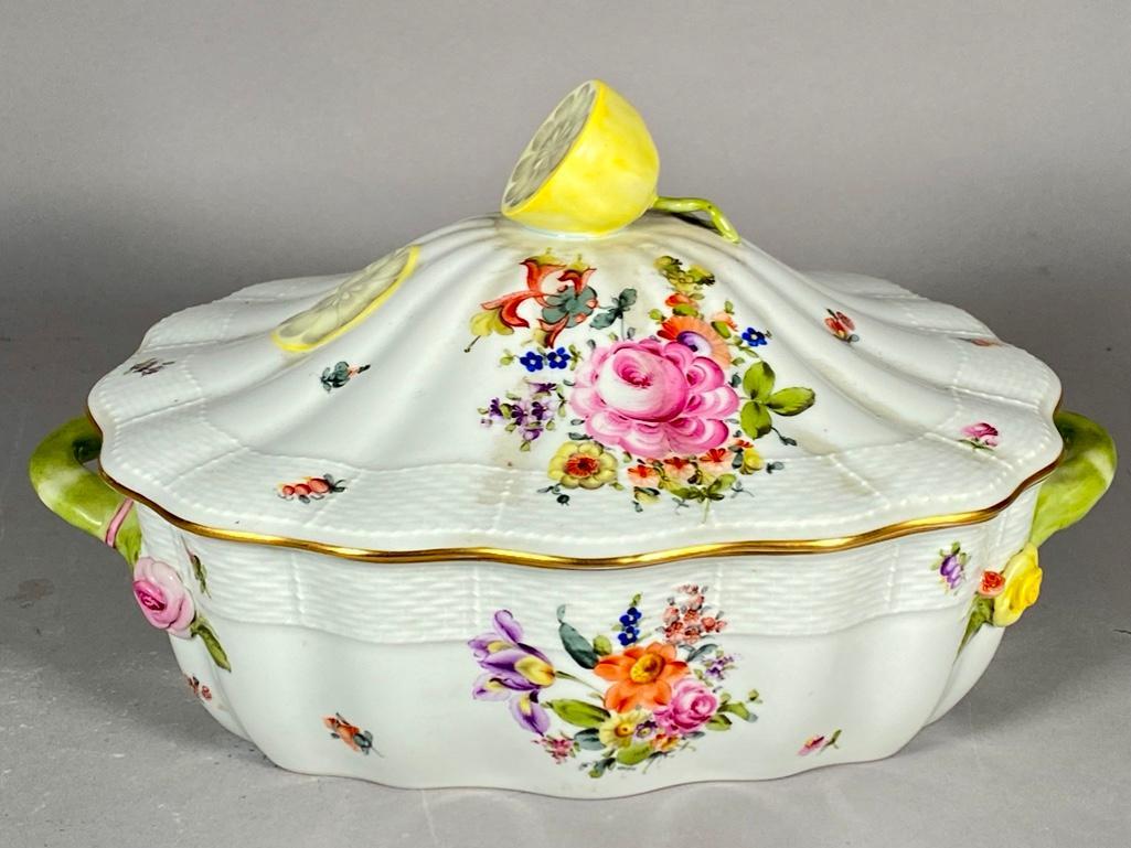 Herend Tureen: Herend Tureen, squared scalloped form decorated with colorful floral sprigs, with lemon knop handle. Dimensions 8 in.h. x 13 in. l. x 10.5 in.w. Condition Very good with no damage or repair. Note on