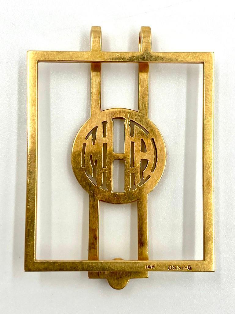 Deco Period Gold Money Clip: Marked 14K yellow gold, set with a natural cabochon sapphire. "AHM" initials in round center. Weight: 11.31 grams Condition: very nice.