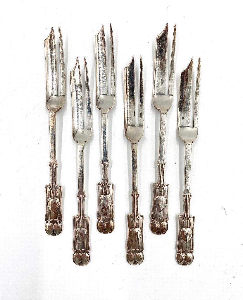 Liberty & Co. Sterling Desert Forks, 1930: Liberty & Co. Sterling Desert Forks, 1930, six forks in fitted Liberty Case, in Arts and Crafts style with stylized plant forms on the handles. Hallmarked. Dimensions: 5 1/8 in.l. Weight: Approxim