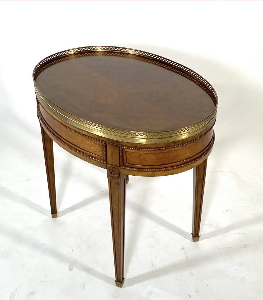Louis XV Style Oval Bouillotte Style End Table: Louis XV Style Oval Bouillotte Style End Table, oval galleried top over a single drawer, on tapered square legs. Dimensions: 25 in.h. x 28 in. l. x 20 in.d. Condition: Overall good condition. Wear con