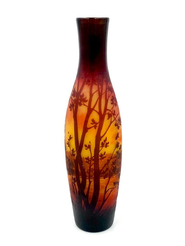 D'Argental Scenic Cameo Glass Vase: D'Argental Scenic Cameo Glass Vase, tall slender form, the gray glass walls mottled with yellow and orange, overlaid with brown, cameo carved with a river landscape with a ruined castle. Signed D&