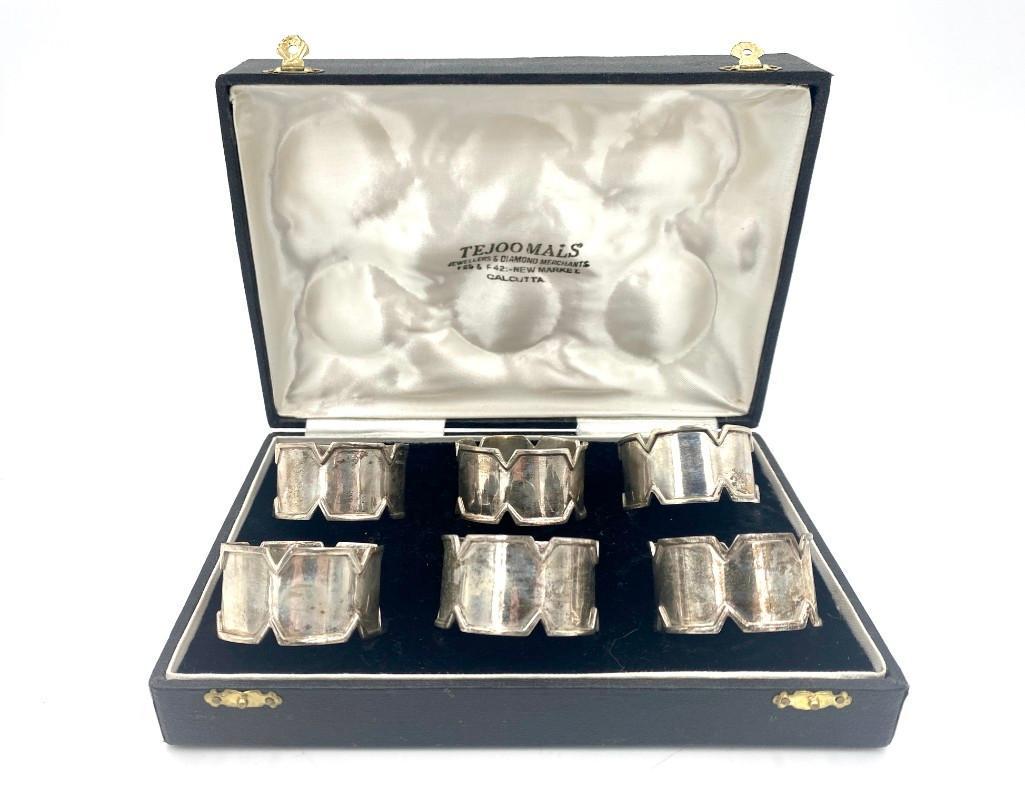 Boxed Set of Indian Sterling Silver Napkin Rings: Boxed Set of Indian Sterling Silver Napkin Rings, chevron form, marked with elephant stamp. In fitted box. Dimensions: 1.75 in. dia. Total Approximate Weight: 171 g. / 5.49778 oz. troy. Condition: Lig