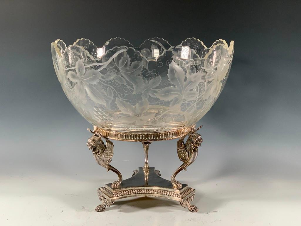 English Crystal and Silver Punchbowl on Stand, 19thc.: English Crystal and Silver Punchbowl on Stand, 19thc., Birmingham, 1861, tripod base with paw feet, with winged lion supports fitted with a scalloped crystal bowl engraved with grapevines and leaves. 