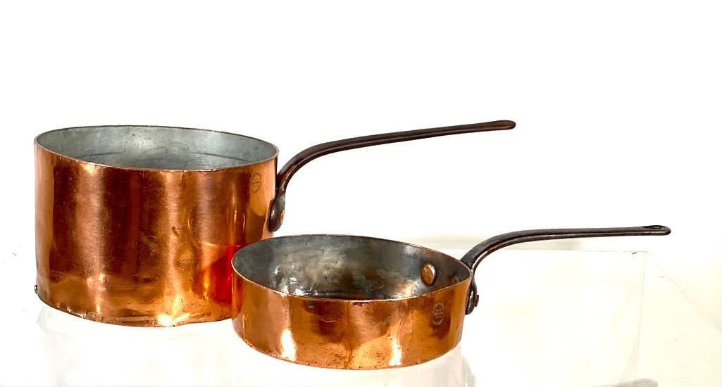 Two L.Barth and Son Copper Saucepans: Two L.Barth and Son Copper Saucepans, each with cast iron handles, impressed L.Barth & Son, New York, 30-32 Cooper Sq. Dimensions: 11 in.dia. and 10 in. dia. Condition: Antique condition with wear fro