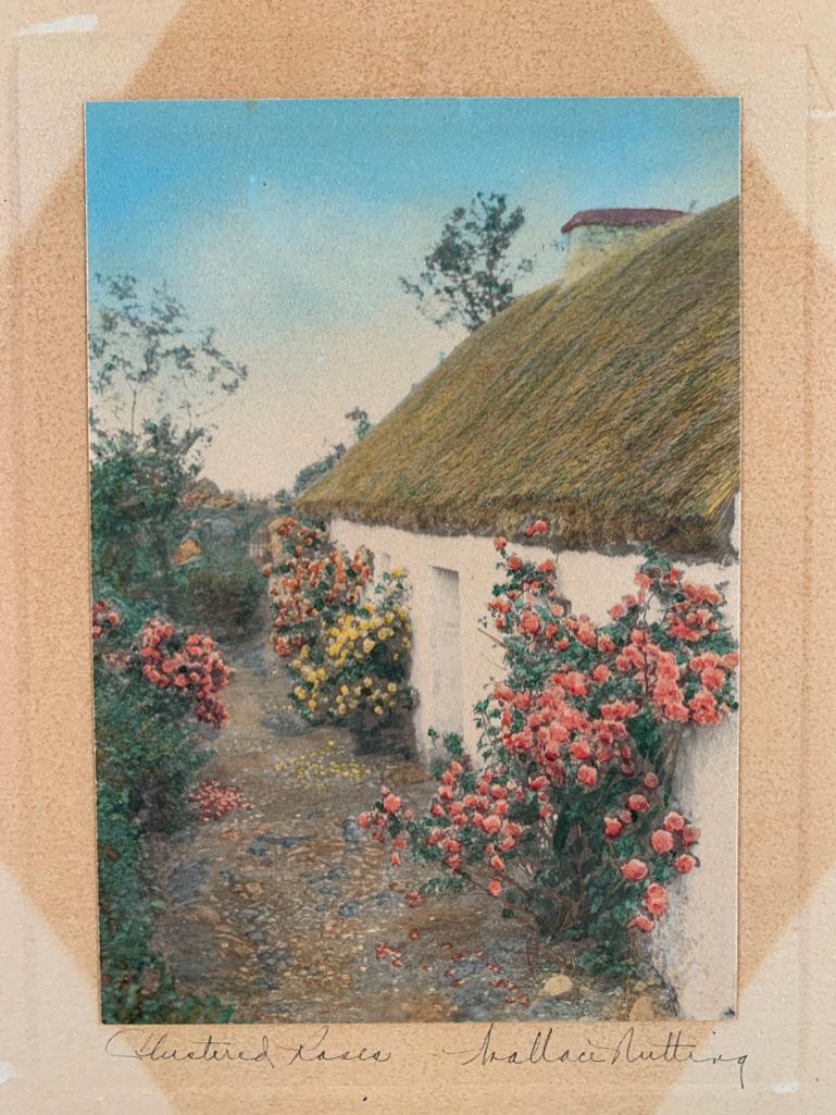 Wallace Nutting "Clustered Roses": View of thatch roof cottage, 8 x 10 inches, Wallace Nutting antique silver gelatin photograph with original hand coloring, framed, under glass. Not inspected out of framing.
