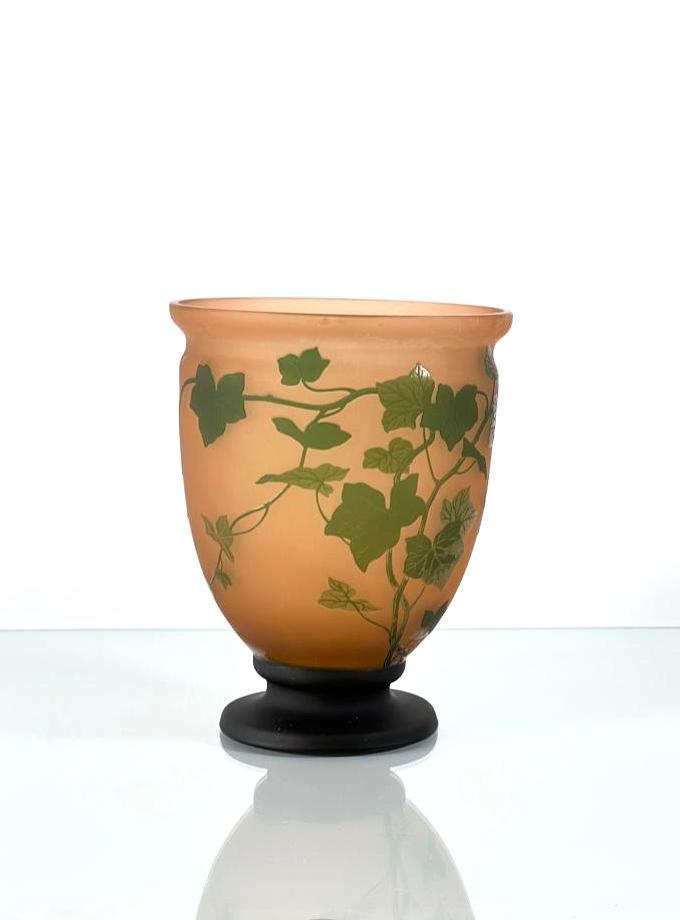 Moser Cameo Glass Vase: Moser Cameo Glass Vase,Â of tapering form on circular foot, the peachy glass walls overlaid with green, cameo carved with ivy vines, signed Moser Karlsbad in cameo and with conjoined monogram LMK