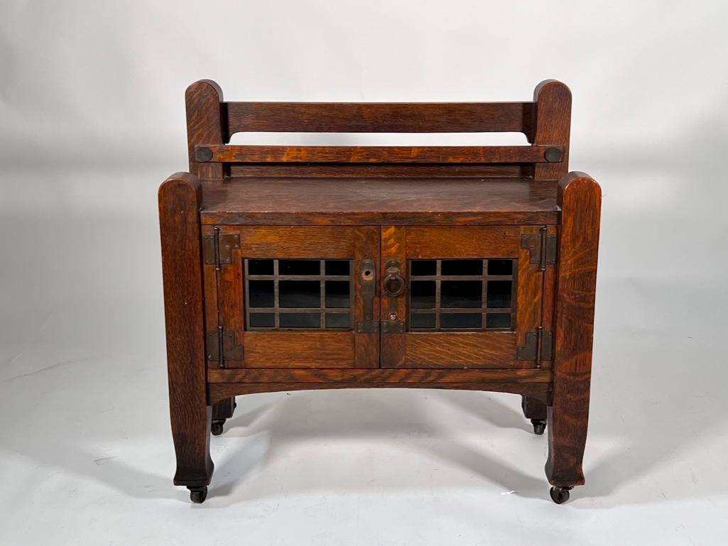 Arts and Crafts Oak Child's Sideboard: Charming Arts and Crafts Oak Child's Sideboard, c.1900, the top with two rounded elements over a plate rack and rectangular top, above a pair of hinged glazed doors with copper mullions and hardwa